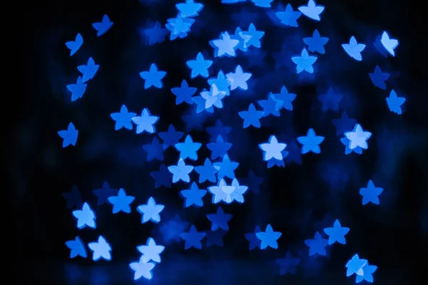 Beautiful Blue Stars Bokeh Black Background — Free Stock Photo