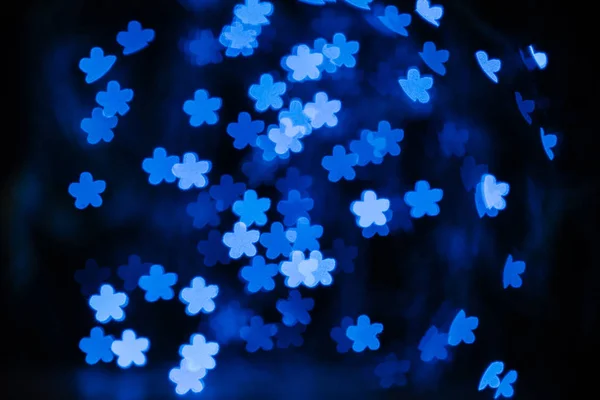 Beautiful Blue Shiny Stars Bokeh Black Background — Free Stock Photo