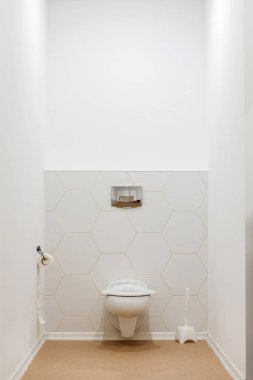 clean white toilet bowl in toilet in modern kindergarten  clipart