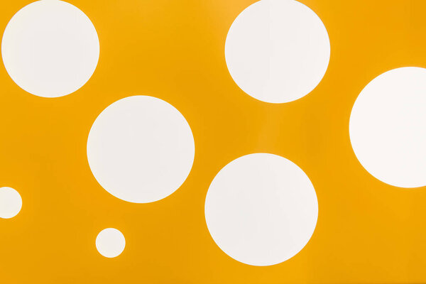 full frame view of bright yellow background with white circles
