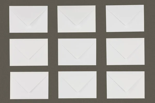 Close View White Envelopes Arranged Isolated Grey Background — Free Stock Photo