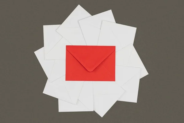 top view of red envelope and white cards isolated on black