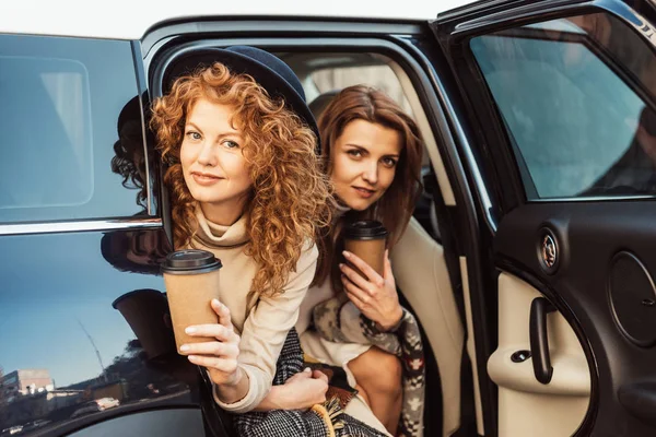 Pretty Adult Women Disposable Coffee Cups Looking Out Car Street — Stock Photo, Image