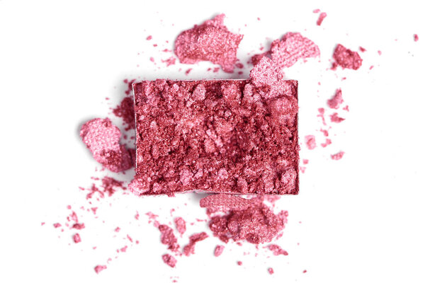 top view of bright pink eyeshadow on white backdrop