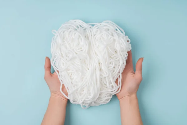 Partial View Woman Holding White Yarn Knitting Hands Blue Background — Free Stock Photo