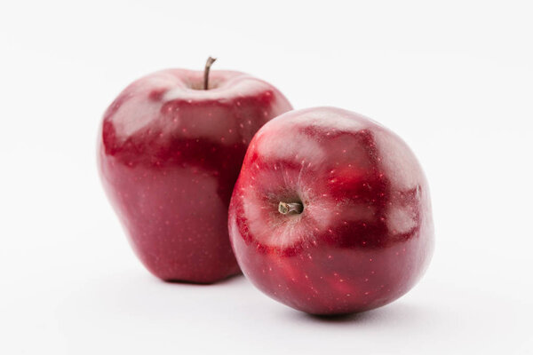 ripe large red delicious apples on white background