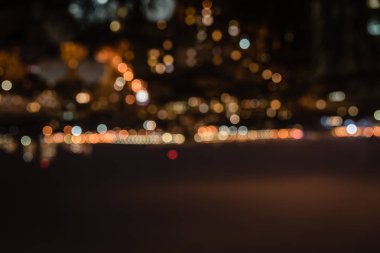 defocused background at night with bokeh lights and copy space