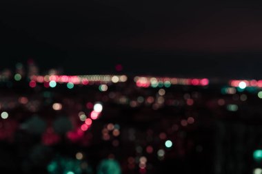 defocused background at night with colorful bokeh lights  clipart
