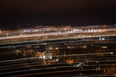 night cityscape with blurred bright illumination clipart