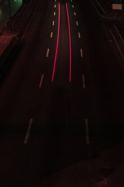 long exposure of road and bright lights at night