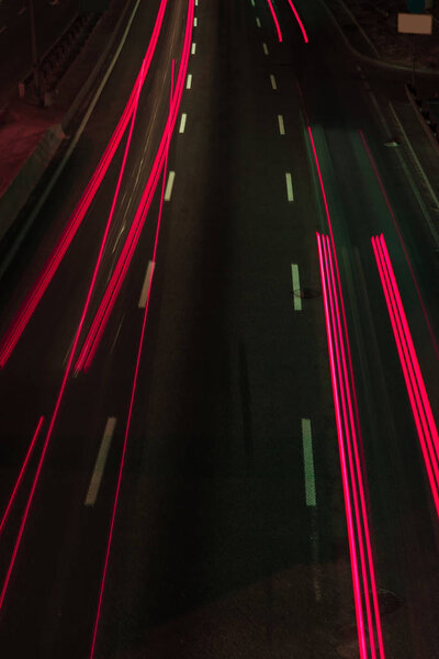 long exposure of road and red lights at night