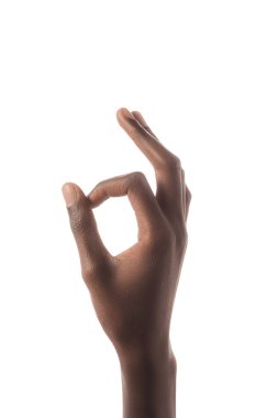 partial view of african american man showing ok sign isolated on white clipart