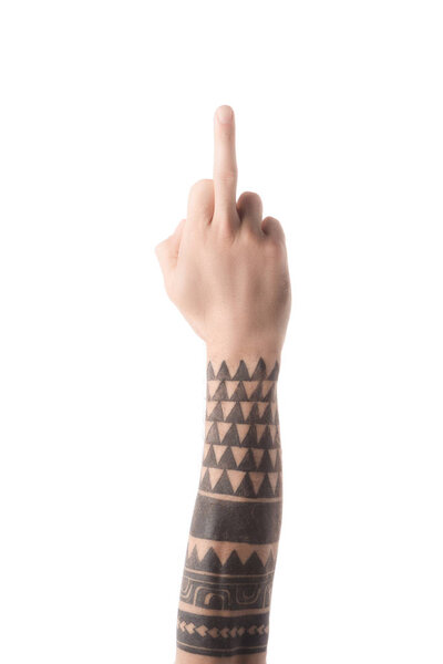 cropped view of tattooed man showing middle finger isolated on white