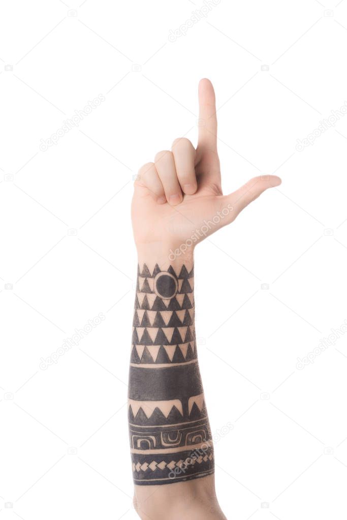 Cropped view of tattooed man showing letter L in deaf and dumb language isolated on white