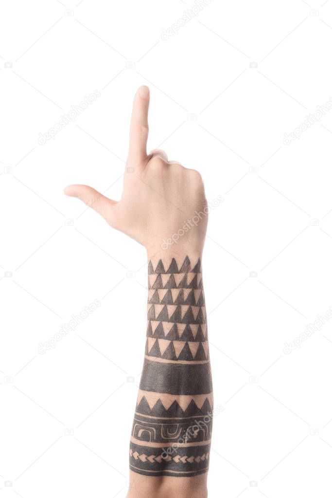 Cropped view of tattooed man showing letter L in deaf and dumb language isolated on white