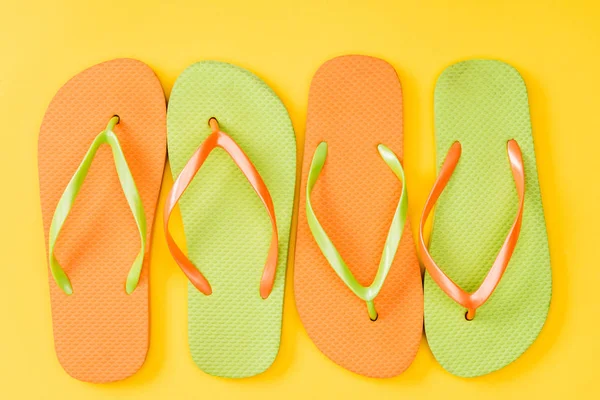 Top View Colorful Flip Flops Yellow Background — Stock Photo, Image