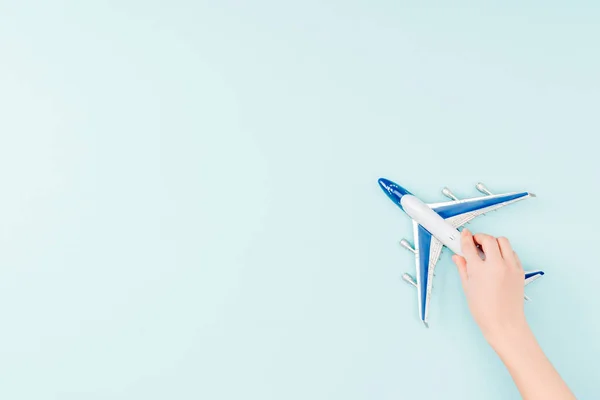 Cropped View Woman Holding Toy Plane Blue Background — Stock Photo, Image