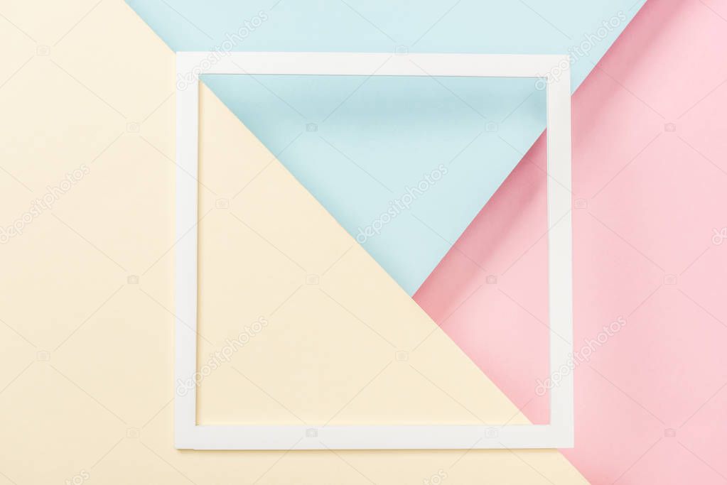 white paper square frame on blank colorful papers