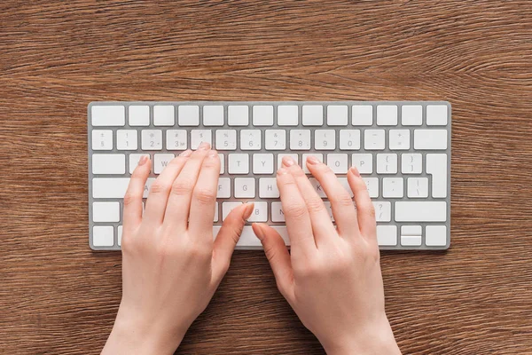Partial View Woman Typing Keyboard Wooden Background — Stock Photo, Image