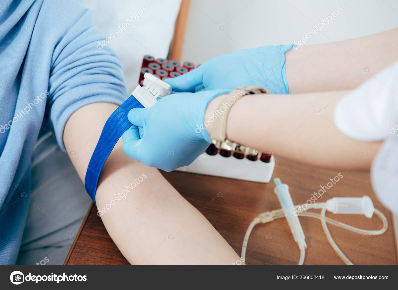 Partial View Doctor Using Tourniquet Blood Test Hospital Stock Photo by