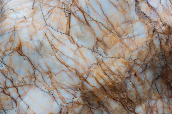 close up view of brown and grey textured marble surface