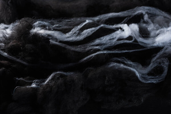 black and white cotton wool clouds, dark Halloween background