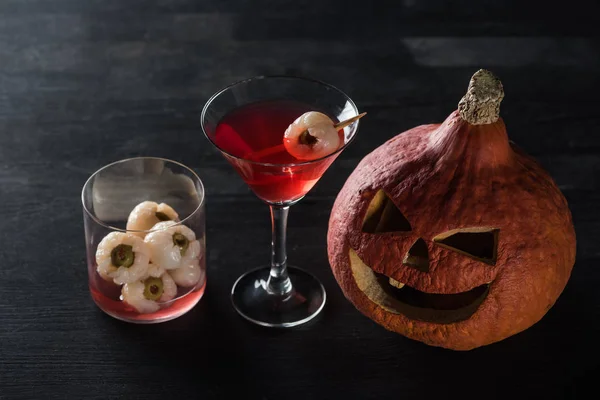 Spooky Carved Halloween Pumpkin Red Cocktail Black Background — Stock Photo, Image