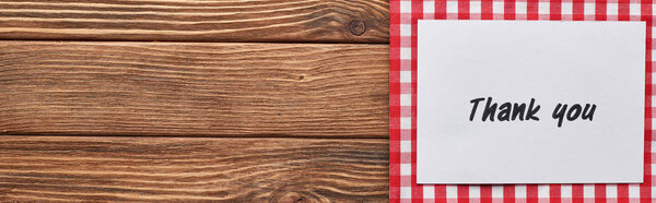 top view of thank you card on wooden brown table with red plaid napkin, panoramic shot