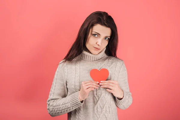 Attractive woman in sweater holding heart-shaped paper cut on pink — Stock Image Attractive Woman Sweater Holding Heart Shaped Paper Cut Pink Stock Picture