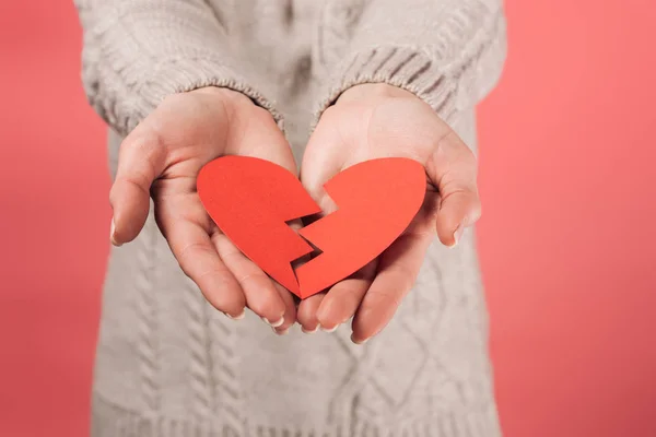 Cropped view of woman in sweater holding paper cut with broken heart on pink — Stock Image Cropped View Woman Sweater Holding Paper Cut Broken Heart Pink Royalty Free Stock Photos