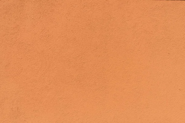 Close-up view of orange rough weathered textured background — Stock Photo
