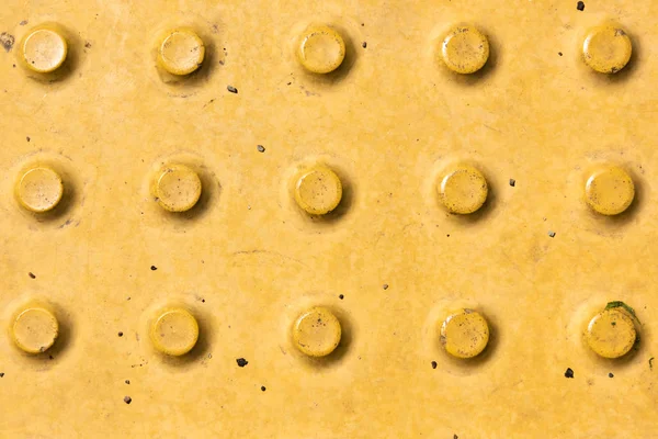 Close-up view of yellow rough weathered metal background — Stock Photo