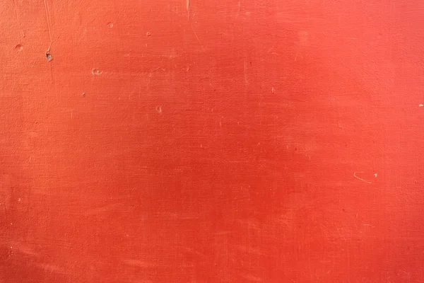 Close-up view of bright red scratched textured background — Stock Photo