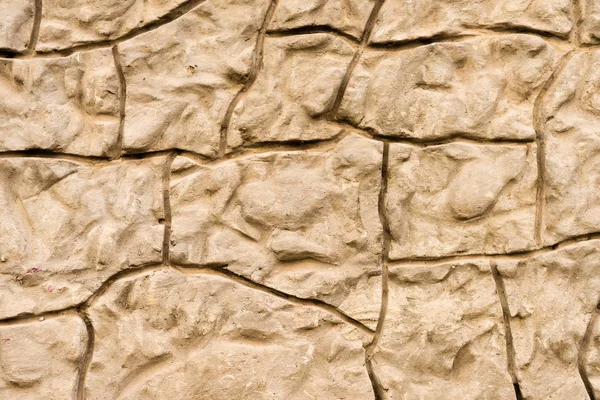 Close-up view of brown weathered stone wall texture — Stock Photo