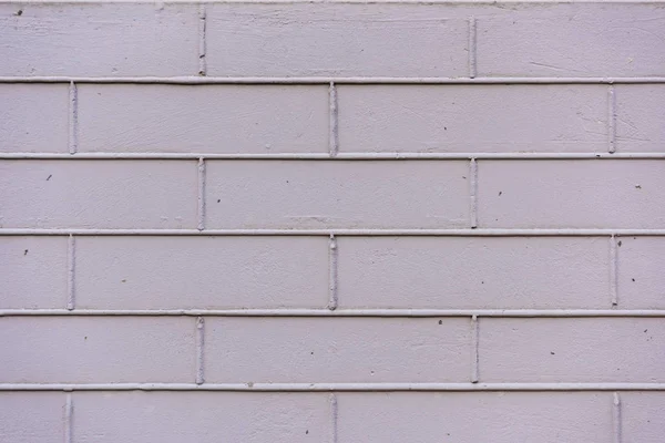 Luz parede de tijolo violeta texturizado fundo — Fotografia de Stock