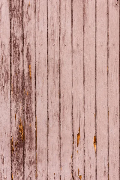 Old scratched brown wooden fence background with vertical planks — Stock Photo