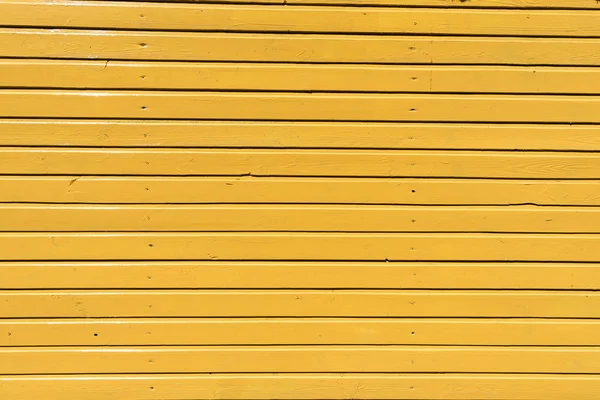 Fundo de madeira amarelo brilhante com pranchas horizontais — Fotografia de Stock