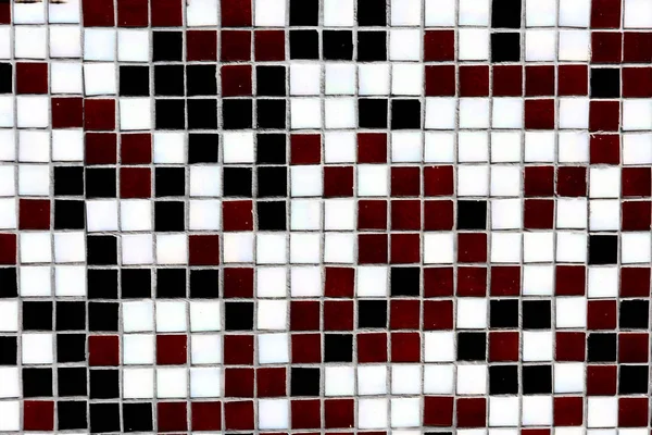 Close-up view of black, white and maroon decorative tiles background — Stock Photo