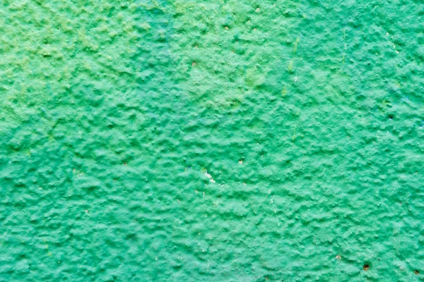 Close-up view of bright green weathered wall texture — Stock Photo