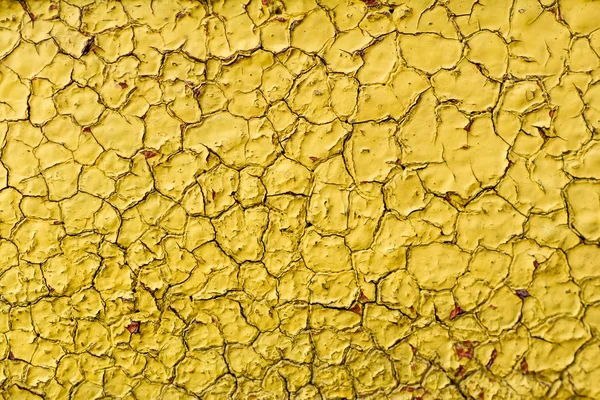 Vue rapprochée de la texture ancienne de la paroi jaune altérée — Photo de stock