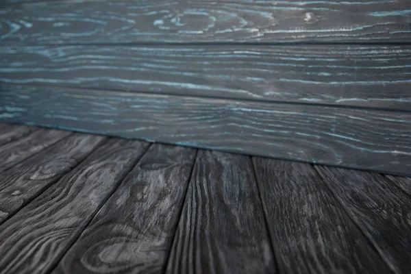 Grey wooden floor and grungy blue wooden wall — Stock Photo