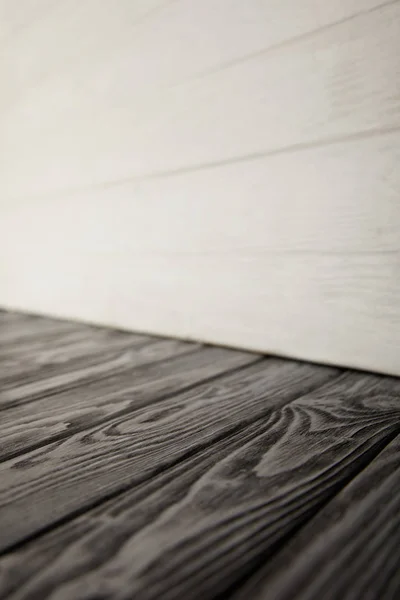 Grey wooden floor and white wooden wall — Stock Photo