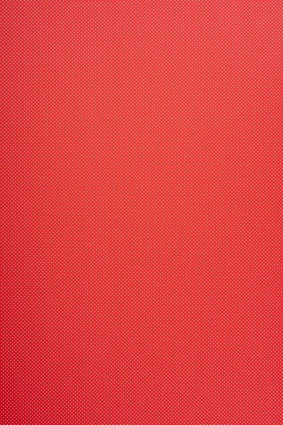 Small polka dot pattern on red background — Stock Photo