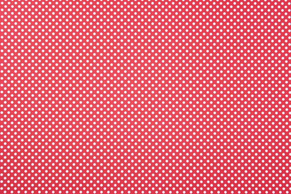 Texture of polka dot pattern on red background — Stock Photo