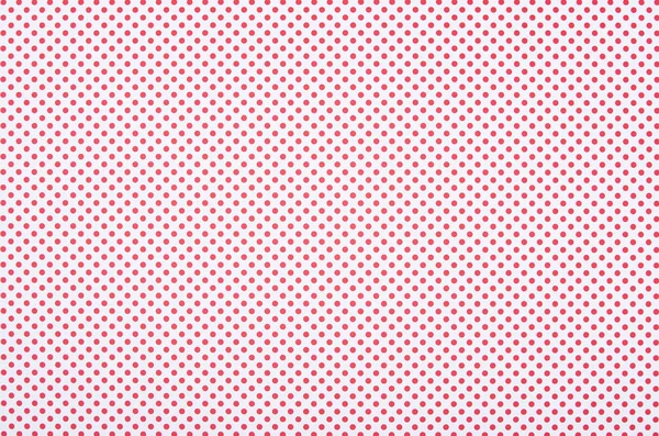 Red polka dot pattern on white background — Stock Photo