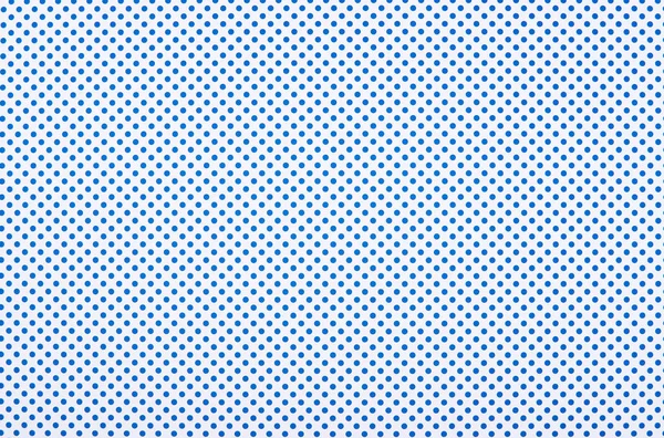 Blue polka dot pattern on white background — Stock Photo
