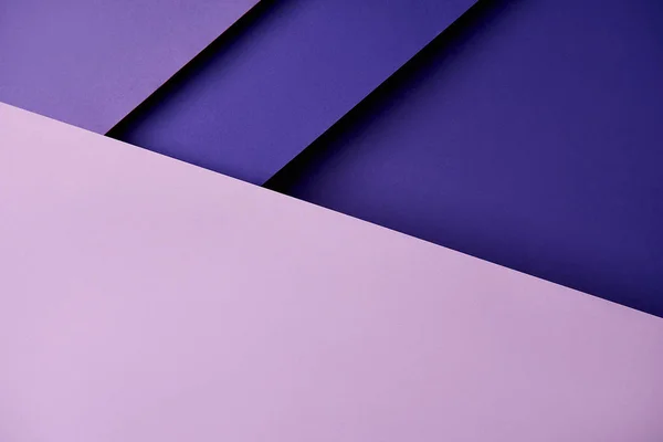 Paper sheets in purple tones background — Stock Photo