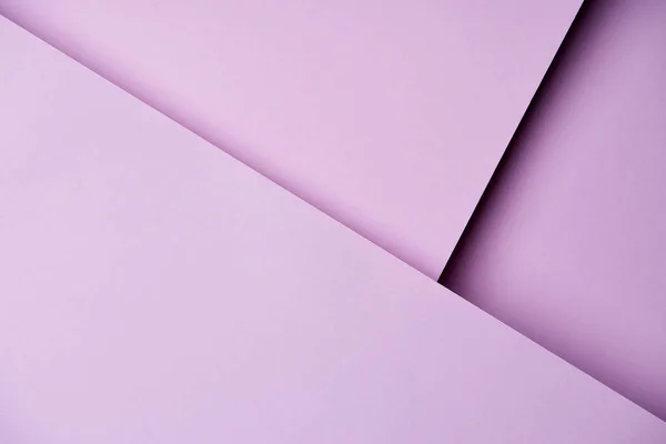 Folhas de papel em tons roxos claros fundo — Fotografia de Stock