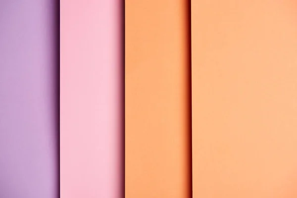 Fond vertical avec feuilles de papier en rose et orange — Photo de stock