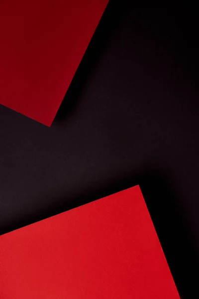 Papierblätter in roten und schwarzen Tönen Hintergrund — Stockfoto